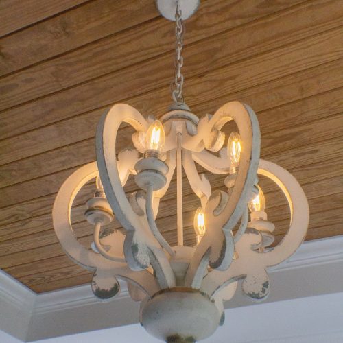 chandelier with arched carved wood structure